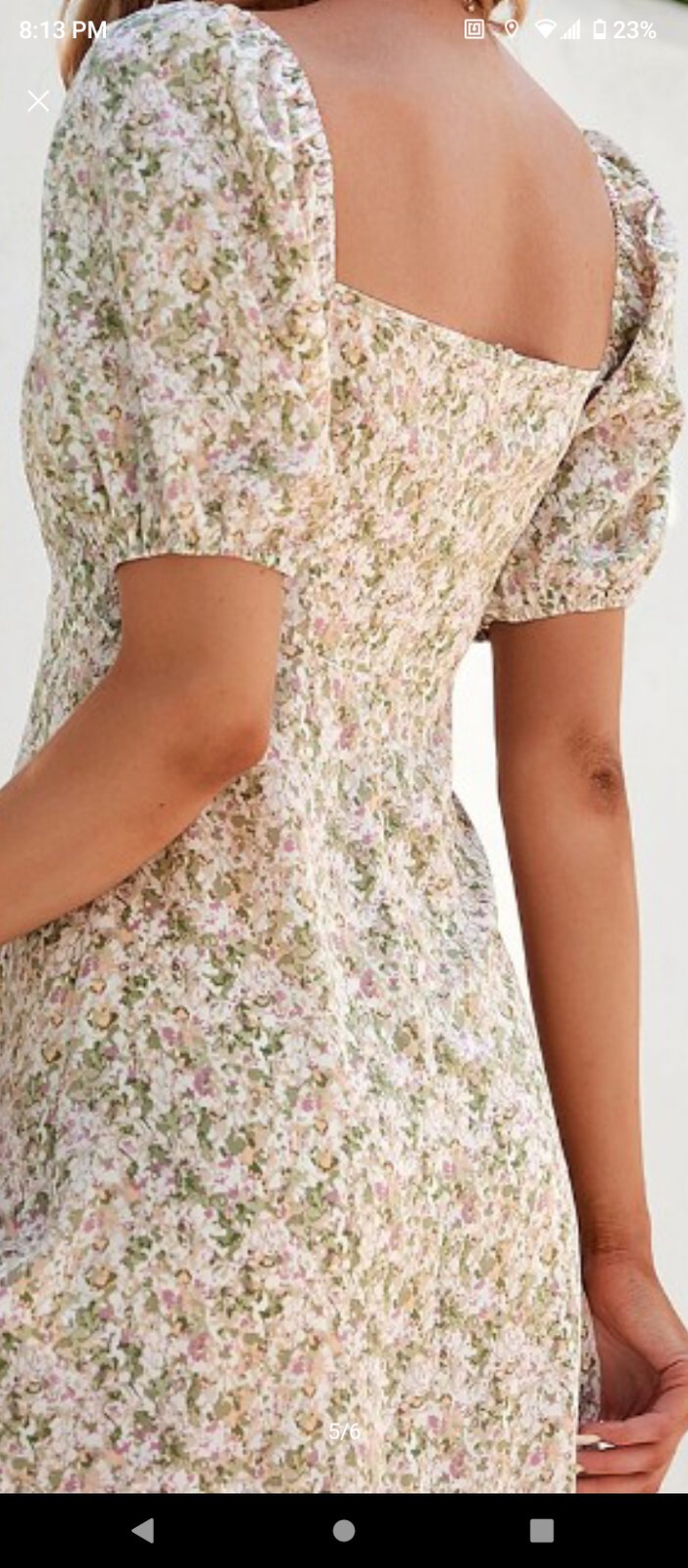 Cute, fun and feminine. Beige and green floral pattern. Short sleeves.