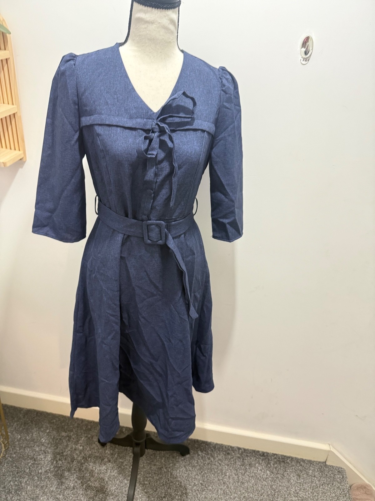 Elegant Blue Knee-Length Dress with Fabric Belt, Bow Tie Neckline, and Button-Up